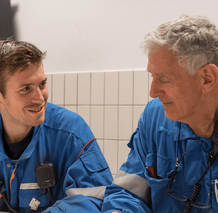 Jozef training a younger employee at the Antwerp complex